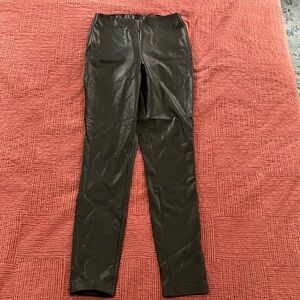 Guess black stretchy leather like pants fits women’s smaller size see photos